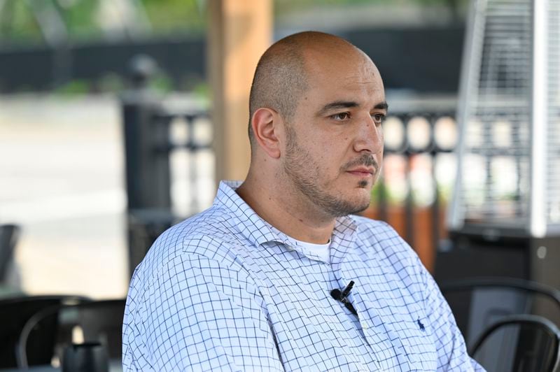 Uncommitted delegate to the Democratic National Convention Abbas Alawieh answers questions during an interview Wednesday, Aug. 14, 2024, in Dearborn, Mich. (AP Photo/Jose Juarez)