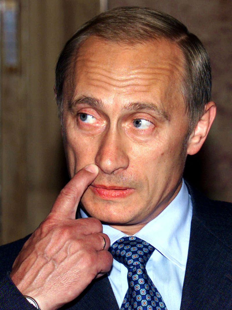 FILE - Russian President Vladimir Putin gestures as he talks to journalists before a series of meetings with leaders of seven other former Soviet republics in the Black Sea resort of Yalta, on Aug. 18, 2000. Putin attended the summit despite the sinking of the nuclear submarine Kursk days earlier. (AP Photo/Alexander Natruskin/Pool, File)