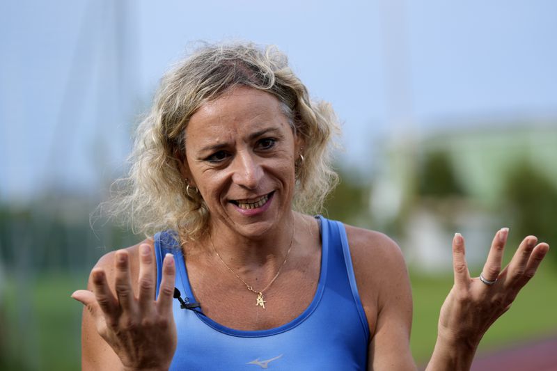 Italy's Valentina Petrillo gestures during an interview with The Associated Press in Pieve di Cento, near Bologna, Italy, Monday, Aug. 19, 2024. Valentina Petrillo is set to become the first transgender woman to compete at the Paralympic Games at the end of this month in Paris. (AP Photo/Antonio Calanni)