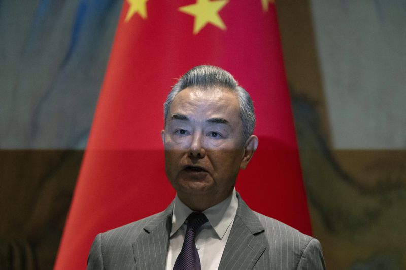 Wang Yi, the director of the Communist Party's Central Foreign Affairs Commission Office reacts near White House national security adviser Jake Sullivan, before their talk at Yanqi lake in Beijing, Tuesday, Aug. 27, 2024. (AP Photo/Ng Han Guan, Pool)