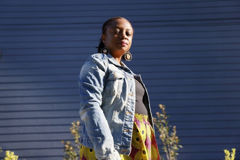 Joycelyn Davis, a direct descendant of Charlie Lewis,  poses for a photograph outside the Africantown Heritage House museum days before its inauguration on Friday, June 30, 2023.  Lewis was one of the last known enslaved Africans who arrived in 1860 on the Clotilda. 
(Miguel Martinez / miguel.martinezjimenez@ajc.com)