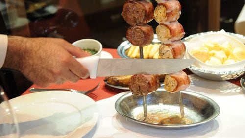 Bacon-wrapped filet mignon and chicken breast at Chama Gaucha in Buckhead. Contributed by Chama Gaucha