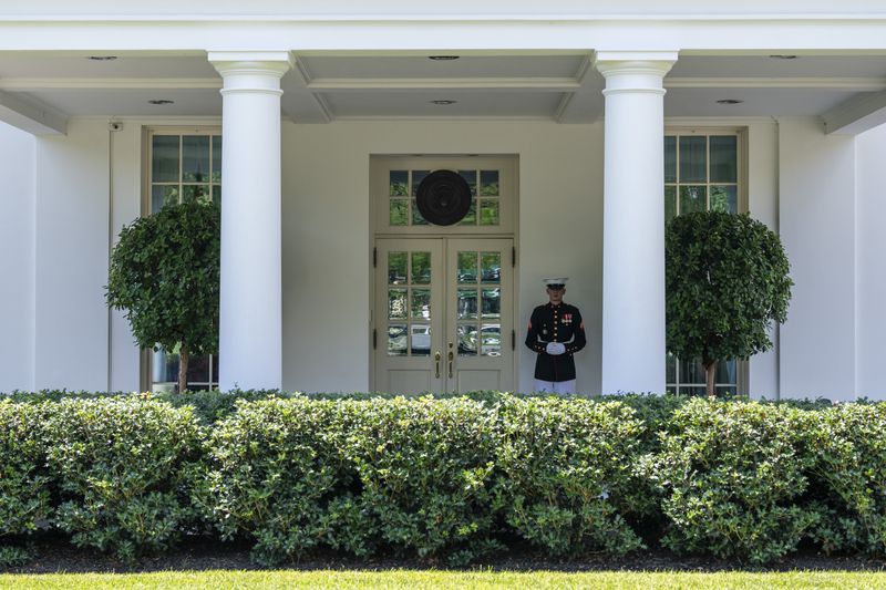 
                        A Marine stands at the entrance to the West Wing at the White House in Washington, on Wednesday, July 3, 2024. President Joe Biden has told a key ally that he knows he may not be able to salvage his candidacy if he cannot convince the public in the coming days that he is up for the job after a disastrous debate performance last week. (Eric Lee/The New York Times)
                      