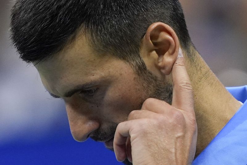 Novak Djokovic, of Serbia, reacts during a third round match against Alexei Popyrin, of Australia, of the U.S. Open tennis championships, Friday, Aug. 30, 2024, in New York. (AP Photo/Julia Nikhinson)