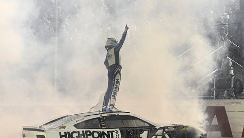 Chase Briscoe celebrates after winning a NASCAR Cup Series auto race at Darlington Raceway, Sunday, Sept. 1, 2024, in Darlington, S.C. (AP Photo/Matt Kelley)