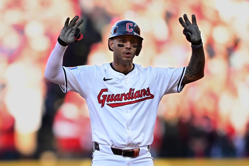 Cleveland Guardians' Brayan Rocchio gestures from second base after hitting a double in the sixth inning during Game 2 of baseball's AL Division Series against the Detroit Tigers, Monday, Oct. 7, 2024, in Cleveland. (AP Photo/David Dermer)