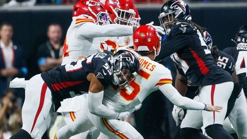 Atlanta Falcons linebacker Kaden Elliss (55) sacks Kansas City Chiefs quarterback Patrick Mahomes (15) as he throws for an interception during the first half on Sunday, Sept. 22, 2024, at Mercedes-Benz Stadium in Atlanta. 
(Miguel Martinez/ AJC)