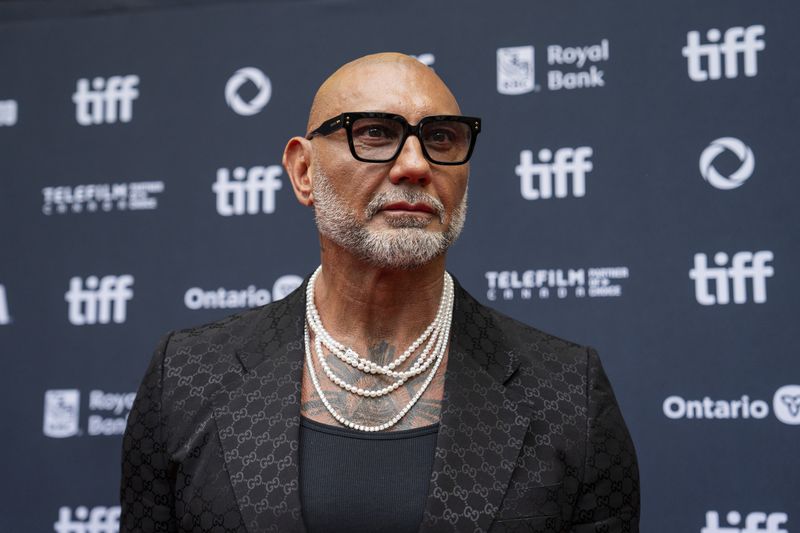 Dave Bautista stands on the red carpet for the premiere of "The Last Showgirl" at the Princess of Wales Theatre, during the Toronto International Film Festival, in Toronto, Friday Sept. 6, 2024. (Paige Taylor White/The Canadian Press via AP)