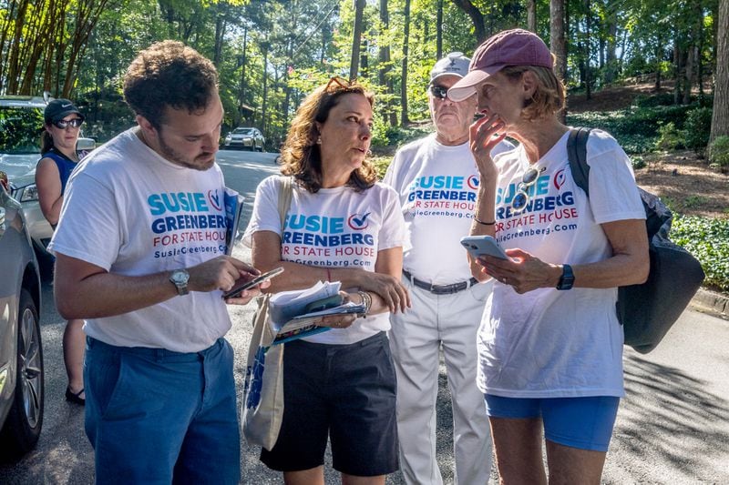 Susie Greenberg, a Democratic candidate for the state House, talks with volunteers Saturday before they spread out around Sandy Springs neighborhoods to speak with voters. (Steve Schaefer / AJC)