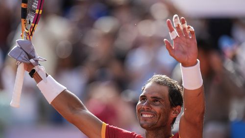 Rafael Nadal of Spain celebrates his victory over Marton Fucsovics of Hungary during the men's singles tennis competition, at the 2024 Summer Olympics, Sunday, July 28, 2024, in Paris, France. (AP Photo/Manu Fernandez)