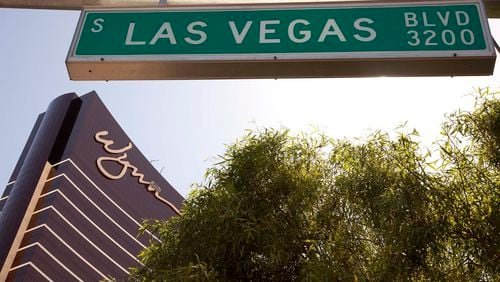 FILE - The Wynn Las Vegas is framed under a Las Vegas Boulevard street sign, Tuesday, April 19, 2011, in Las Vegas. (AP Photo/Julie Jacobson, File)