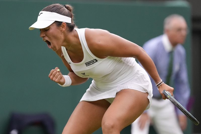 Jessica Bouzas Maneiro of Spain reacts after winning a point against Marketa Vondrousova of the Czech Republic during their first round match at the Wimbledon tennis championships in London, Tuesday, July 2, 2024. (AP Photo/Kirsty Wigglesworth)