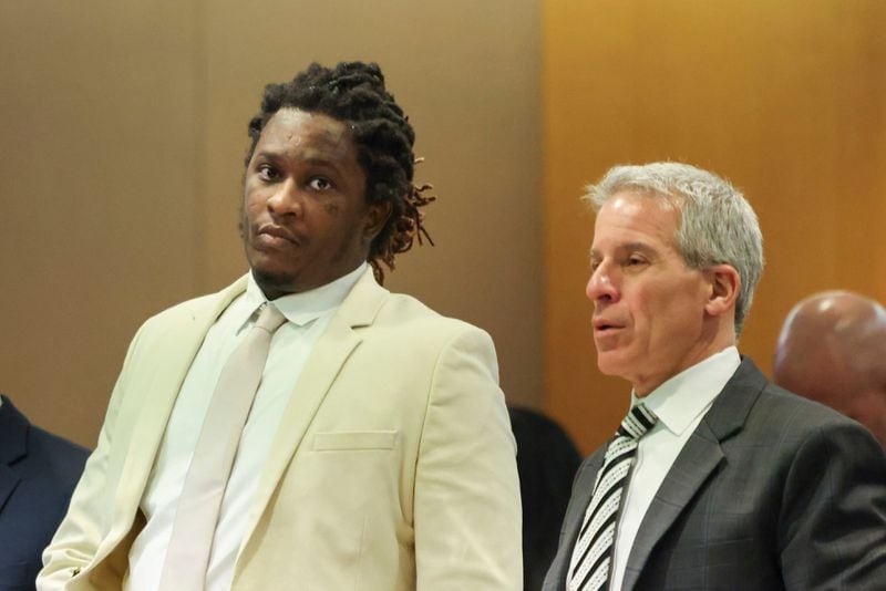 Atlanta rapper Young Thug, whose real name is Jeffery Williams, stands next to one of his defense attorneys, Brian Steel, right, at the courtroom of Judge Ural Glanville at the Fulton County Courthouse, on March 22, 2024, in Atlanta. (Jason Getz/The Atlanta Journal-Constitution/TNS)