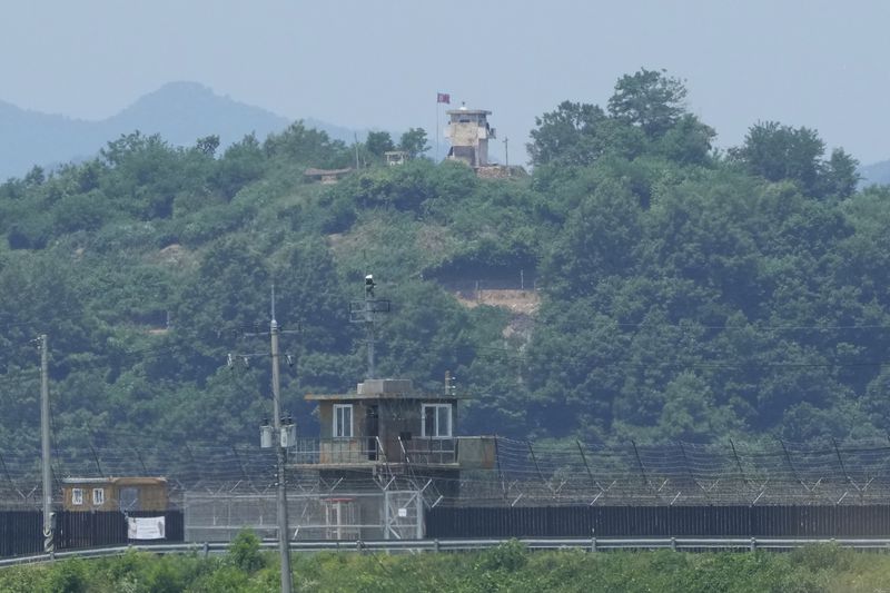 FILE - A North Korean military guard post, top, and a South Korean post, bottom, are seen from Paju, South Korea, near the border with North Korea, Tuesday, June 18, 2024. South Korea’s military said Friday, June 21, 2024, that it again fired warnings shots to repel North Korean soldiers who temporarily crossed the rivals’ land border on Thursday for the third time this month.(AP Photo/Ahn Young-joon, File)