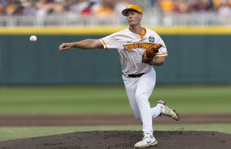 Tennessee's AJ Causey throws to a Texas A&M batter duirng the first inning in Game 1 of the NCAA College World Series baseball finals in Omaha, Neb., Saturday, June 22, 2024. (AP Photo/Rebecca S. Gratz)