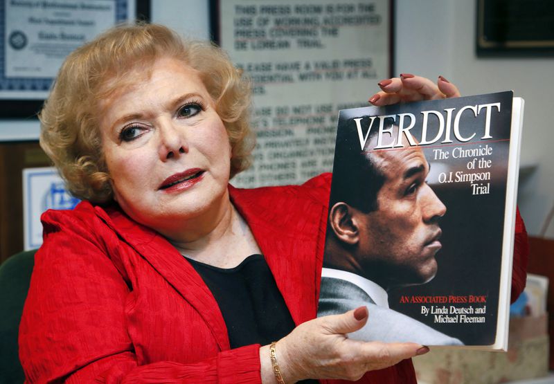 FILE - Associated Press special correspondent Linda Deutsch holds a copy of her book, "Verdict, The Chronicle of the O.J. Simpson Trial," at her home in Los Angeles, Dec. 11, 2014. (AP Photo/Nick Ut, File)