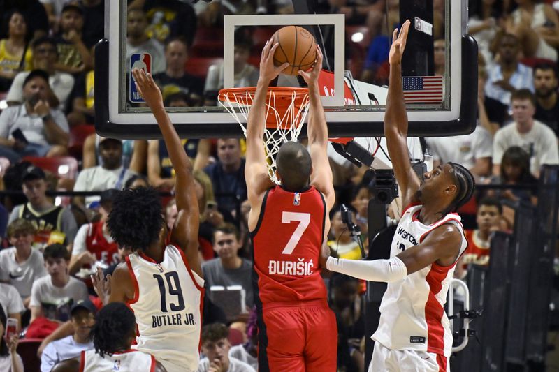 Atlanta Hawks forward Nikola Druidic (7) dunks against the Washington Wizards during the first half of an NBA summer league basketball game Friday, July 12, 2024, in Las Vegas. (AP Photo/David Becker)