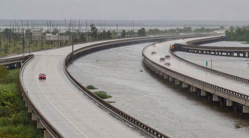 Sparse traffic moves along Interstate 10, Wednesday, Sept. 11, 2024, near Frenier Landing, La., ahead of Hurricane Francine. (David Grunfeld/The Times-Picayune/The New Orleans Advocate via AP)