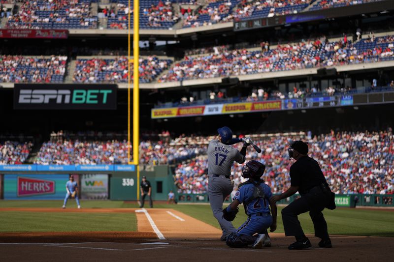 Los Angeles Dodgers' Shohei Ohtani flies out against Philadelphia Phillies pitcher Aaron Nola during the first inning of a baseball game, Thursday, July 11, 2024, in Philadelphia. (AP Photo/Matt Slocum)