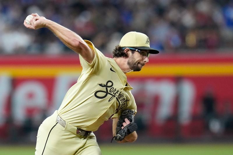 Arizona Diamondbacks pitcher Zac Gallen throws against the Los Angeles Dodgers during the first inning of a baseball game Friday, Aug. 30, 2024, in Phoenix. (AP Photo/Ross D. Franklin)