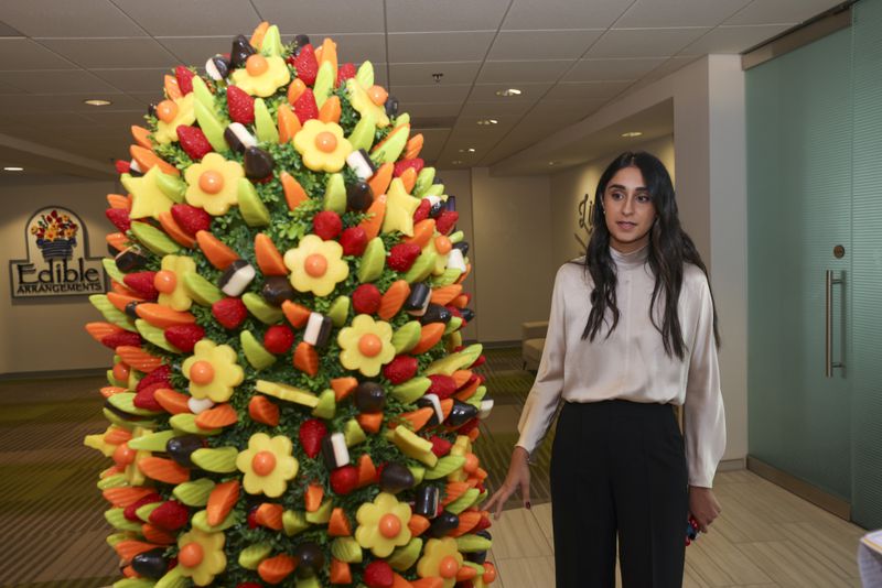 Edible CEO Somia Farid Silber discusses the main display in the front of their Atlanta office on Friday, Oct. 4, 2024. (Jason Getz/AJC)

