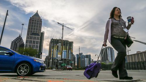 Sally Gilmore walks on 14th Street  in downtown Atlanta.  JOHN SPINK / JSPINK@AJC.COM