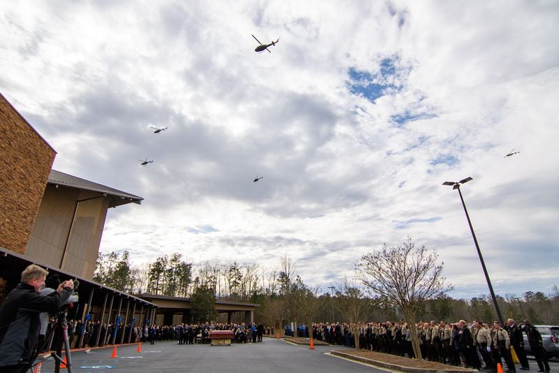 Helicopters flyover during Coweta County Sheriff’s Office Eric Anthony Minix's service at Crossroads Church in Sharpsburg, GA, Monday, January 8, 2024. Investigator Minix passed away during the apprehension of a vehicle theft suspect on Thursday, January 4, 2024. (Jamie Spaar for the Atlanta Journal Constitution)