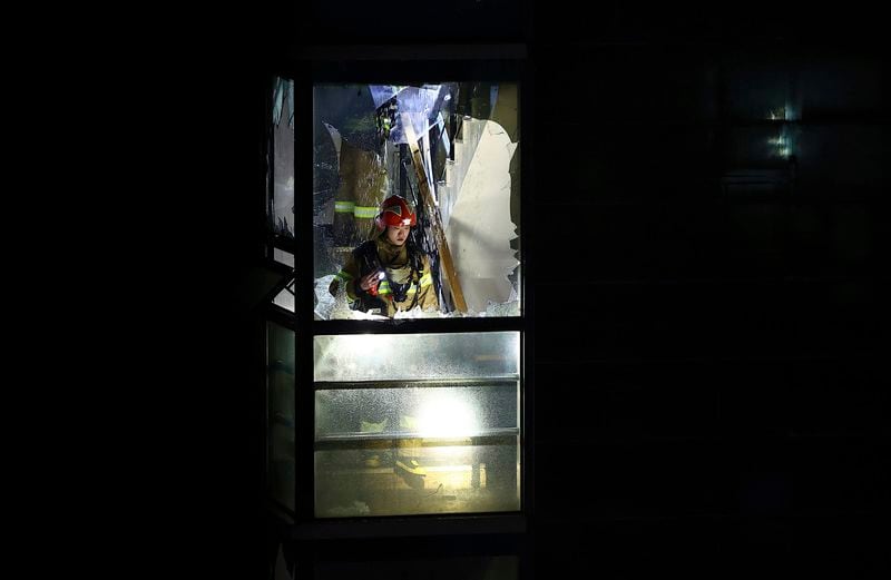 A firefighter searches for missing people after a fire broke at a hotel in Bucheon, South Korea, Thursday, Aug. 22, 2024. (Kim Geum-soo/Newsis via AP)