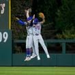 New York Mets' Brandon Nimmo (9) and Tyrone Taylor (15) celebrate after winning Game 1 of a baseball NL Division Series against the Philadelphia Phillies, Saturday, Oct. 5, 2024, in Philadelphia. (AP Photo/Matt Slocum)