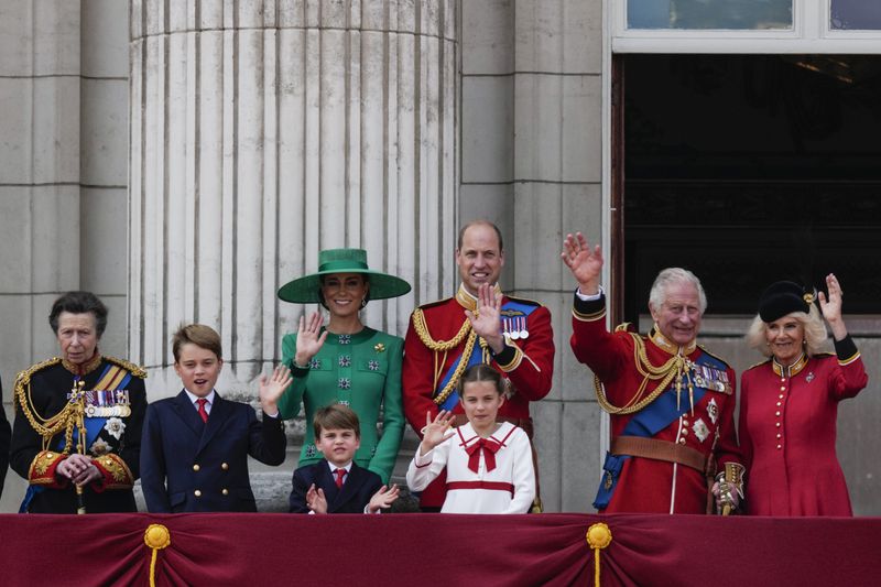 FILE - From left, Princess Anne, Prince George, Kate, Princess of Wales, Prince Louis, Prince William, Princess Charlotte, King Charles III and Queen Camilla greet the crowd from the balcony of Buckingham Palace after the Trooping The Colour parade, in London, June 17, 2023. The Princess of Wales says she is “making good progress” in her cancer treatment and will attend the royal Trooping the Color ceremony on Saturday June 15, 2024, Kate’s first public appearance since her diagnosis. (AP Photo/Alastair Grant, File)