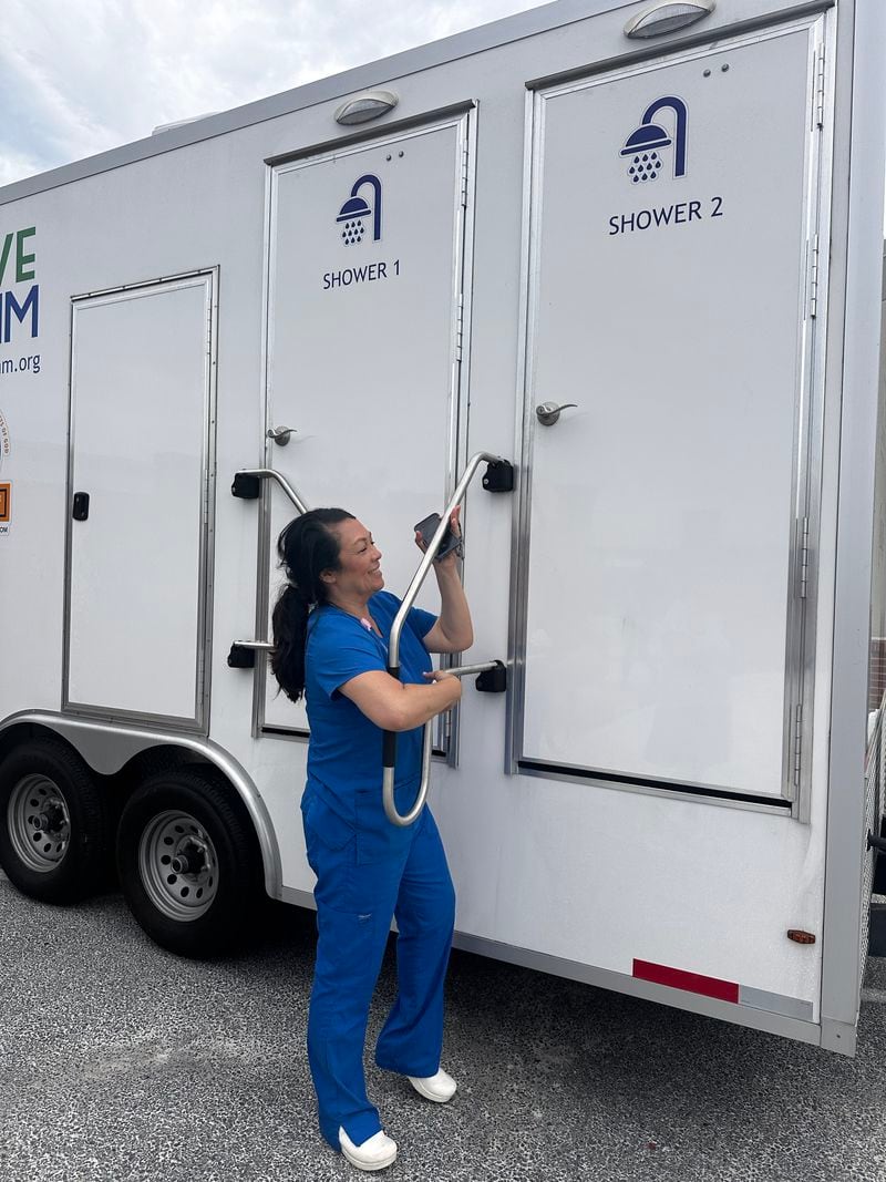 Angela Ammons Handley, CEO of Clinch Memorial Hospital, a 25-bed rural hospital in Homerville in Clinch County, checks out the mobile showers brought in after the storm. (Courtesy of Clinch Memorial Hospital)