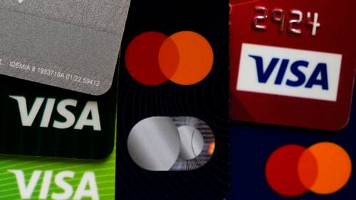 FILE - Several VISA and MASTER credit cards are shown in Buffalo Grove, Ill., Feb. 8, 2024. Visa reports earnings on Tuesday, July 23, 2024. (AP Photo/Nam Y. Huh, File)