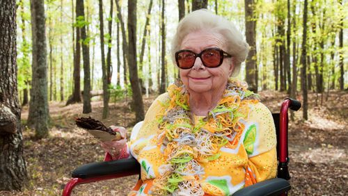 Lessie Smithgall, 102, raises a spade of dirt at Wednesday’s groundbreaking for Smithgall Woodland Garden, being created on 165 rolling Gainesville acres that she and her late husband Charles donated to the Atlanta Botanical Garden in 2002.