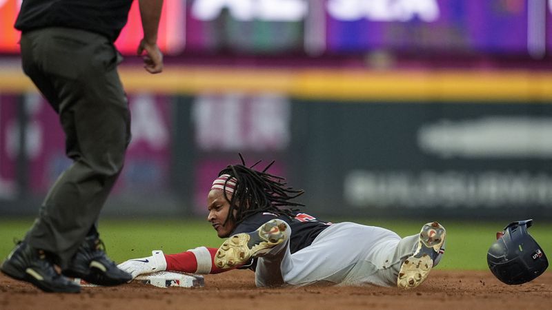 Washington Nationals' CJ Abrams (5) steals second base against the Atlanta Braves in the third inning of a baseball game, Saturday, Aug. 24, 2024, in Atlanta. (AP Photo/Mike Stewart)