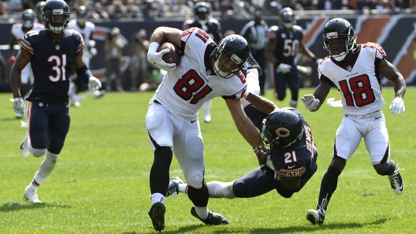 Atlanta Falcons tight end Austin Hooper (81) runs the ball after a