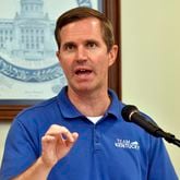 Kentucky Gov. Andy Beshear addresses a crowd gathered at the Breathitt Co. Courthouse to discuss progress in flood recovery efforts in Jackson, Ky., Friday, July 26, 2024. (AP Photo/Timothy D. Easley)