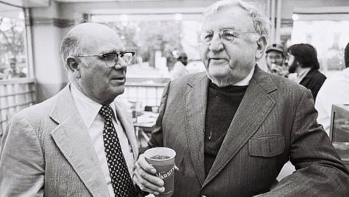 UGA legend William Tate chats with Athens merchant A.F. "Cooter" Haygood as he enjoys the official last meal at the downtown Athens Varsity in 1978. Bill King (right) and his brother Jon can be seen above Tate’s shoulder. CONTRIBUTED BY JOHN TOON