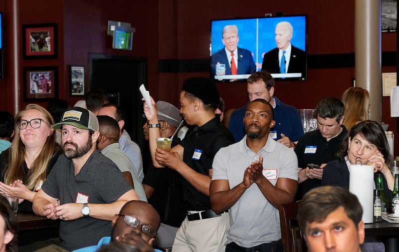 Guests of the Atlanta Young Republicans and Greater Georgia gather at Hudson's Grille to watch last week's presidential debate between Donald Trump and Joe Biden.