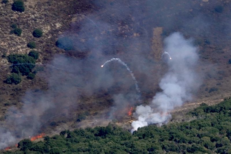 Flames and smoke rise from an Israeli airstrike on Mahmoudieh mountain, as seen from Marjayoun town, south Lebanon, Tuesday, Sept. 24, 2024. (AP Photo/Hussein Malla)