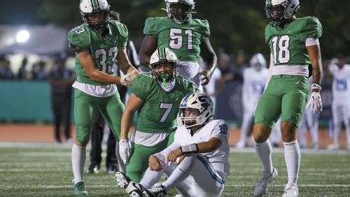 Roswell linebacker Ryder Duffy (7) celebrates his sack of Seckinger quarterback Julian Lapene (10) during the second half at Roswell High School, Friday, Sept. 20, 2024, in Roswell, Ga. (Jason Getz / AJC)

