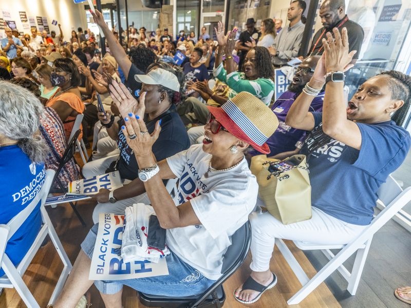 Rochelle Jackson (Center) cheers as Parker Short The president of Georgia Young Democrats speaks at the Biden-Harris and Georgia Democrats for DeKalb County Office Opening in Decatur Saturday, July 6, 2024   (Steve Schaefer / AJC)