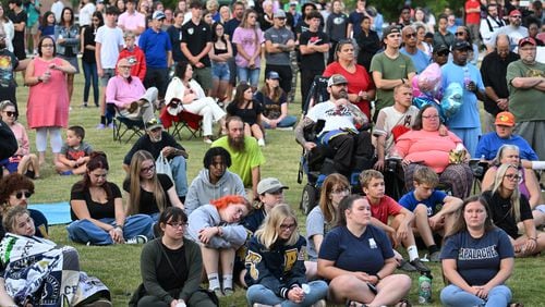 A community candlelight vigil on Sept. 4 at Jug Tavern Park in Winder, Georgia, in memory of four people who were killed in a school shooting at Apalachee High School that day, (Hyosub Shin/The Atlanta Journal-Constitution)