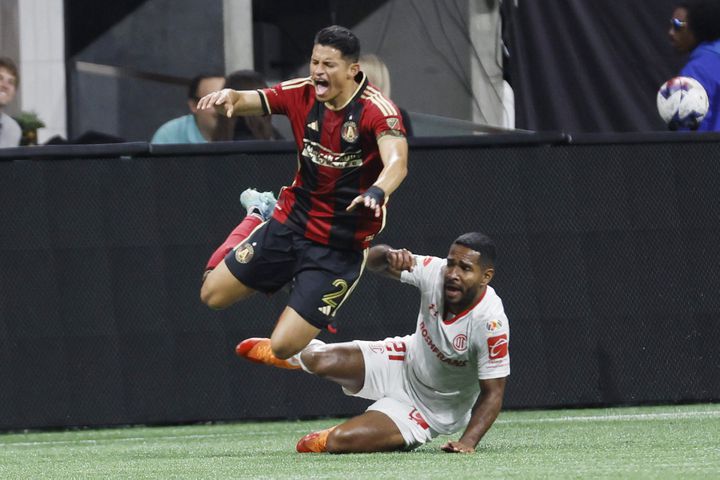 Atlanta United defender Ronald Hernandez reacts as he gets fouled by Toluca’s defender Brayan Angulo (21) during the second half against Liga MX Toluca of an exhibition match on Wednesday, Feb 15, 2023, in Atlanta.
 Miguel Martinez / miguel.martinezjimenez@ajc.com