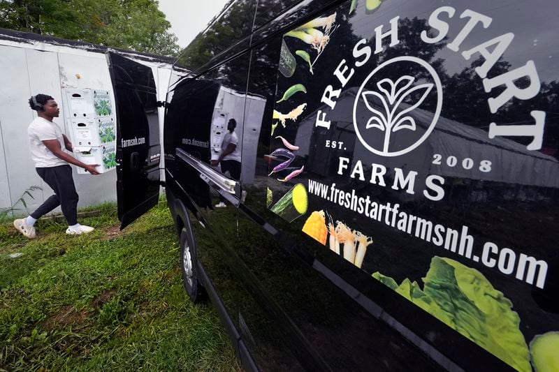 Vegetables picked and packaged that morning are loaded onto a delivery truck at Fresh Start Farm, Aug. 19, 2024, in Dunbarton, N.H. (AP Photo/Charles Krupa)