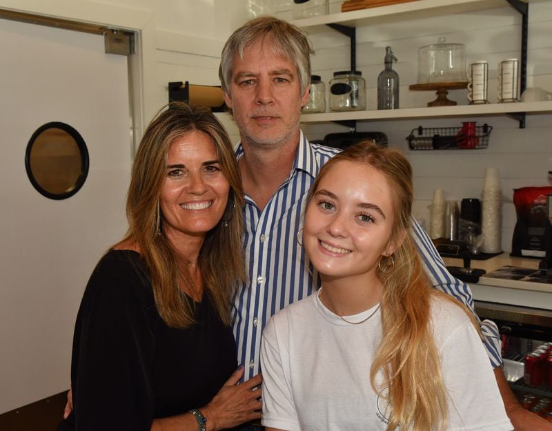 Belén de la Cruz (left) with husband Fernando Stengel and one of their daughters, Indy, 16, a junior in high school who works at the shop learning all aspects of the business. (Chris Hunt for The Atlanta Journal-Constitution)