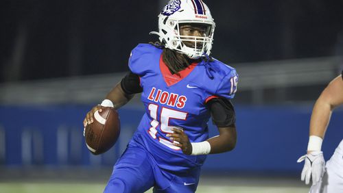 Peachtree Ridge quarterback Darnell Kelly (15) looks to pass during the first half against Lambert in the Class 7A playoffs at Peachtree Ridge high school, Friday, November 10, 2023, in Suwanee, Ga. (Jason Getz / Jason.Getz@ajc.com)