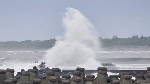 Waves crash onto the coastline as Typhoon Krathon approaches to Taiwan in Yilan County, eastern coast of Taiwan, Tuesday, Oct. 1, 2024. (AP Photo/Chiang Ying-ying)