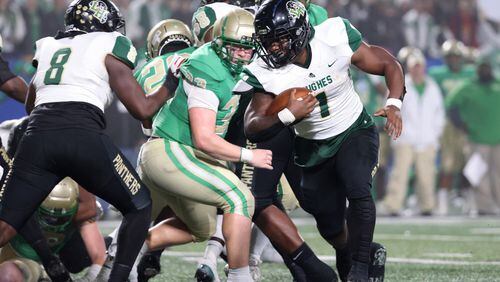 December 10, 2021 - Atlanta, Ga: Langston Hughes running back Antonio Martin (1) scores a rushing touchdown in the first half against Buford in the Class 6A state title football game at Georgia State Center Parc Stadium Friday, December 10, 2021, Atlanta. JASON GETZ FOR THE ATLANTA JOURNAL-CONSTITUTION



