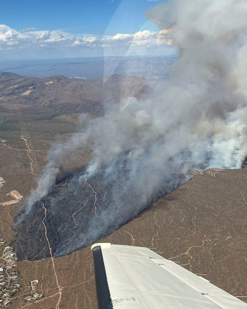 This aerial photo released by the Arizona Department of Forestry and Fire Management shows smoke rising from the Boulder View fire Thursday, June 27, 2024, near Phoenix. Air tankers and helicopters have joined nearly 200 firefighters battling a wildfire northeast of Phoenix that has forced dozens of residents to flee their homes. (Bobby Ortland/Arizona Department of Forestry and Fire Management via AP)