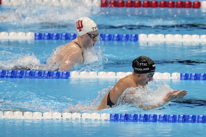 Kate Douglass swims during the Women's 200 breaststroke finals Thursday, June 20, 2024, at the US Swimming Olympic Trials in Indianapolis. (AP Photo/Michael Conroy)